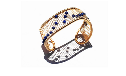 Tana Acton, Gold Movable Mobius Cuff with Kinetic Lapis Lazuli Beads